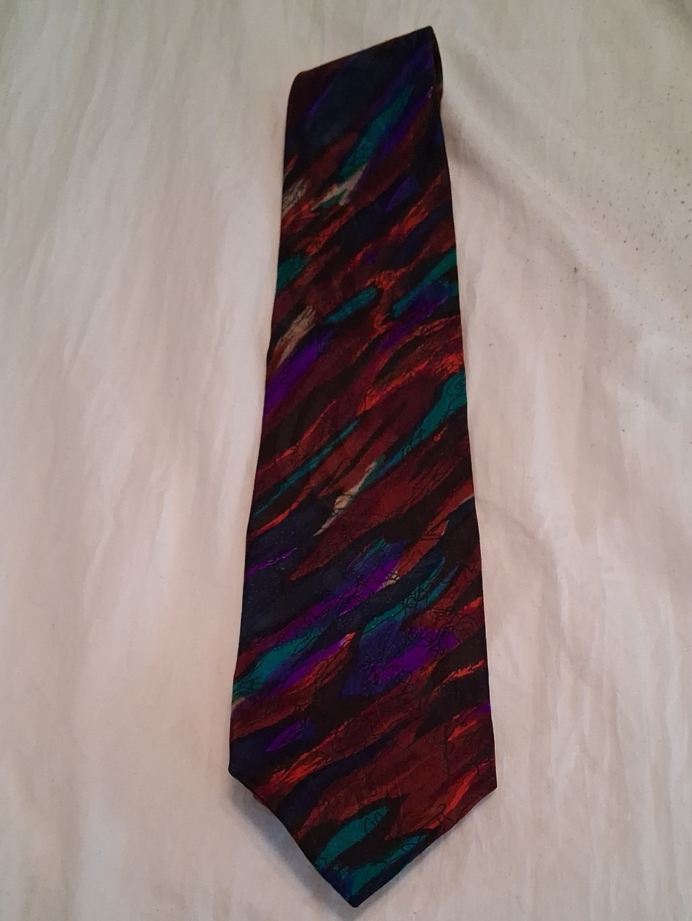 J. Garcia Vivid Red, Purple, Teal, and Black Abstract Stripe Tie. 100% Silk